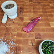Grass-fed beef tenderloin tail steak on an end-grain butcher block with flake salt, cracked pepper, and chimichurri — Wishbone Heritage Farms, Saint George, SC