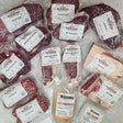 Wishbone Heritage Farms grass-fed beef variety pack — eye of round, sirloin tip steak, London broil, boneless beef for stew, bone-in NY strip steaks, ground beef, short ribs, beef bone broth, and beef tallow in vacuum-sealed packaging — Saint George, SC