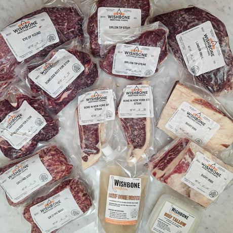 Wishbone Heritage Farms grass-fed beef variety pack — eye of round, sirloin tip steak, London broil, boneless beef for stew, bone-in NY strip steaks, ground beef, short ribs, beef bone broth, and beef tallow in vacuum-sealed packaging — Saint George, SC