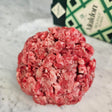 Fresh grass-fed ground beef keto blend on white marble with Maldon sea salt — Wishbone Heritage Farms, South Carolina
