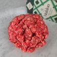 Fresh grass-fed ground beef on white marble with Maldon sea salt — Wishbone Heritage Farms, South Carolina