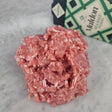 Fresh pasture-raised ground chicken on white marble with Maldon sea salt — Wishbone Heritage Farms, South Carolina